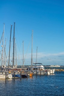 Strande marina near Kiel, Rendsburg-Eckernförde district, AIDA, ship masts, dolphins, Baltic Sea,