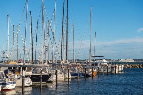 Strande marina near Kiel, Rendsburg-Eckernförde district, AIDA, ship masts, dolphins, Baltic Sea,