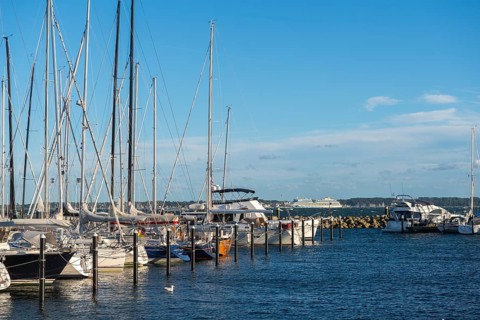 Strande marina near Kiel, Rendsburg-Eckernförde district, AIDA, ship masts, dolphins, Baltic Sea,
