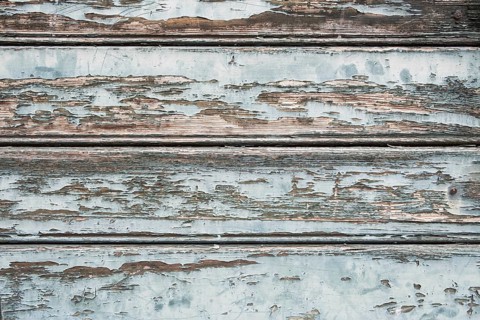 Old wooden door with peeling paint, texture, background, Germany