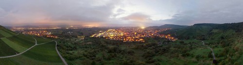 Dusk over an illuminated town, surrounded by vineyards and orchards, Korb and Kleinheppach in the