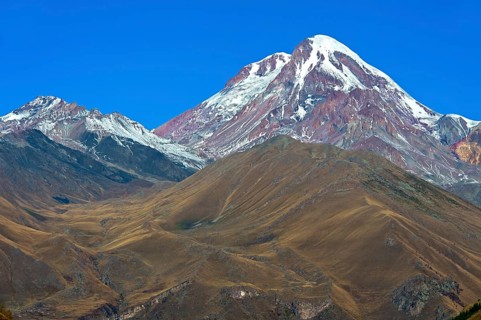 The snow and ice-covered peak of Kazbek, Stepantsminda, Georgia