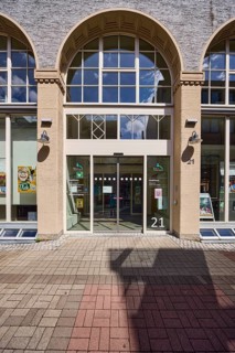 Townhouse, pedestrian zone, building, facade with windows, entrance area, citizens' office, city