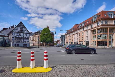 Half-timbered house, general architecture, traffic light crossing, bollards, pavement made of
