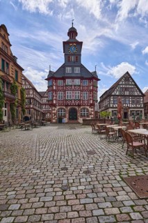 Historic town hall, old town, square, half-timbered houses, tower clock, cobblestone pavement,