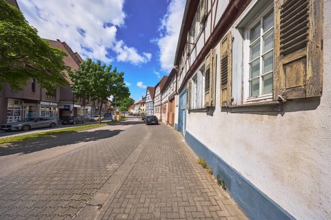 Historic half-timbered houses, general architecture, street, car park with vehicles, facade with