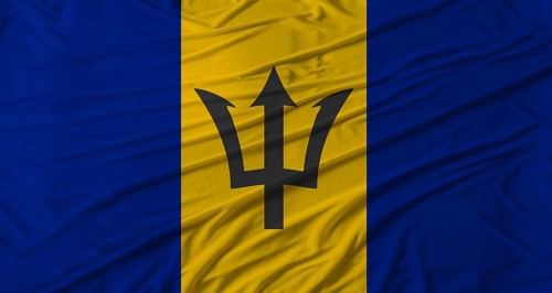 Barbadian flag waving. Flag of Barbados with cloth texture