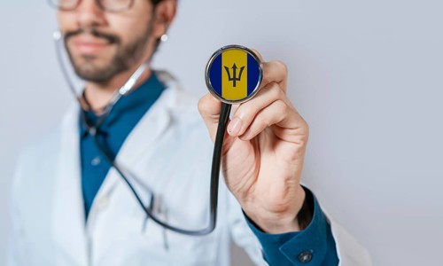 Doctor holding stethoscope with Barbados flag. Barbados health and care concept, Barbados flag on