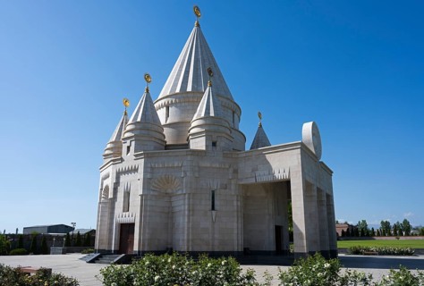 White temple with high towers and arches in front of a clear sky, Yazidi temple, Yazidi temple, the