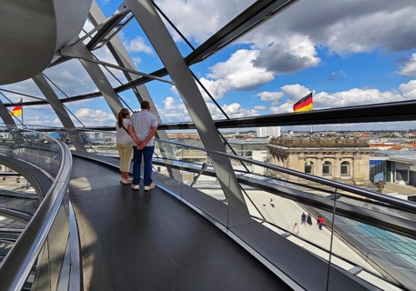 Interior view of the Reichstag dome with visitors and German flags, Reichstag building, government