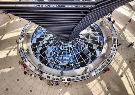 Reichstag dome, interior view from top to bottom of the mirror cone with visitors, Reichstag