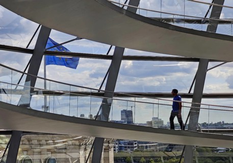 Interior view of the Reichstag dome with a view of a European flag and a person, Reichstag