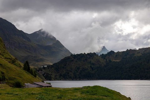 On the shore of Lago Ritom, view towards Passo Sole, Airolo, Ticino, Switzerland