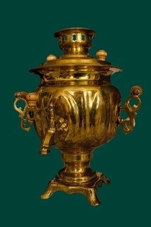 A 19th-century brass samovar, isolated on a green background, Russia