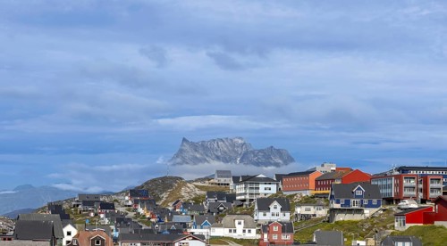 Panoramic view of Greenland capital Nuuk with colored houses located near fjords and icebergs