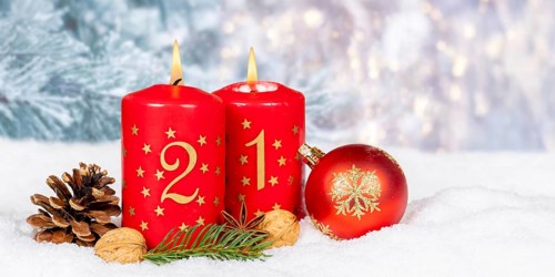 Second 2nd Advent candle for Christmas Christmas card in winter with text free space Copyspace