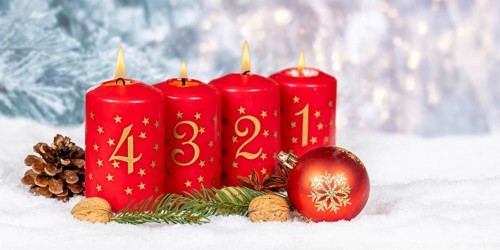 Fourth 4th Advent candle for Christmas Christmas card in winter with text free space Copyspace