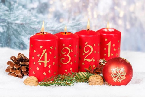 Fourth 4th Advent candle for Christmas Christmas card in winter with copy space Copyspace in