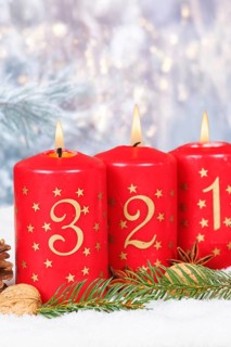 Third 3rd Advent candle for Christmas Christmas card in winter with copy space Copyspace in