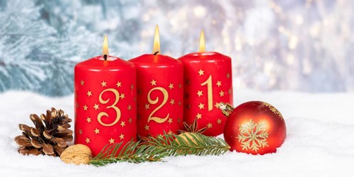 Third 3rd Advent candle for Christmas Christmas card in winter with text free space Copyspace