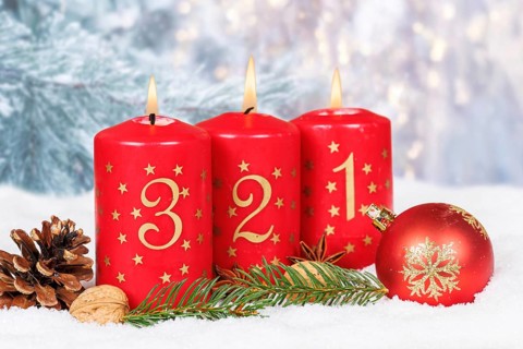 Third 3rd Advent candle for Christmas Christmas card in winter with copy space Copyspace in