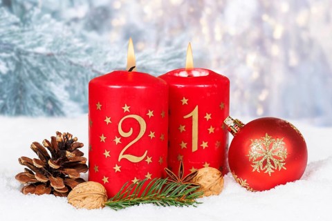Second 2nd Advent candle for Christmas Christmas card in winter with copy space Copyspace in