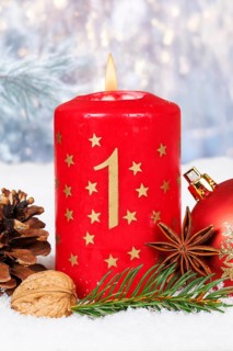 First 1st Advent candle for Christmas Christmas card in winter with copy space Copyspace in