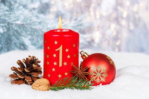 First 1st Advent candle for Christmas Christmas card in winter with copy space Copyspace in