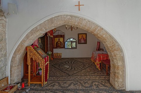 Interior of a church of the Virgin Mary Tsambika (Kyra Psili), with stone arch and icons, spacious