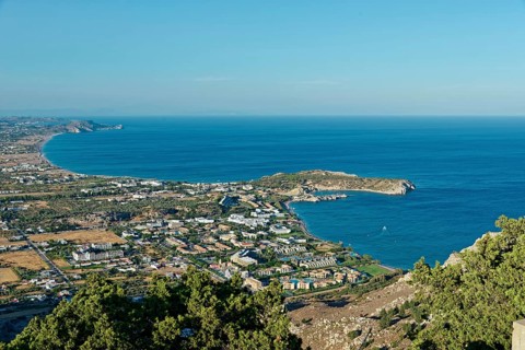 Coastal landscape of Kolymbia and Faliraki, with a view of the sea and town in the foreground under