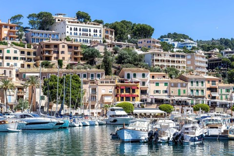 Port de Soller town on Majorca holiday by the sea yacht harbour with boats trip in Port de Sóller,