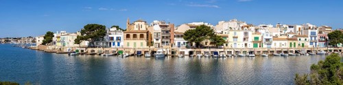 Colourful houses in Portocolom Fishing village on Majorca Panorama with boats Holiday by the sea