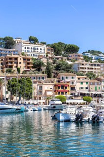 Port de Soller town on Majorca holiday by the sea yacht harbour with boats trip in Port de Sóller,