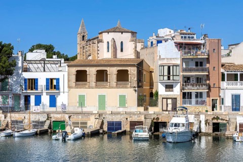 Colourful houses in Portocolom Fishing village on Majorca with boats Seaside holiday in Portocolom,