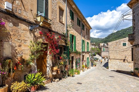 Valldemossa village on Majorca building with flowers trip in Valldemossa, Spain