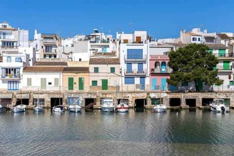 Colourful houses in Portocolom Fishing village on Majorca with boats Seaside holiday in Portocolom,