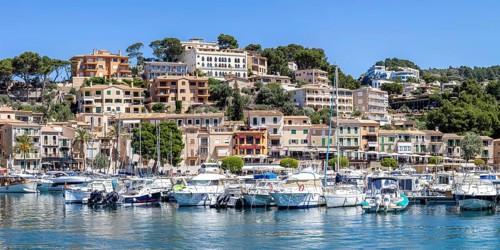Port de Soller town on Majorca panoramic holiday by the sea yacht harbour with boats trip in Port