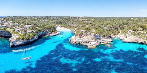 Aerial view of Cala Llombards beach on the island of Majorca from above in the Mediterranean