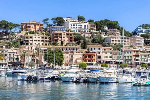 Port de Soller town on Majorca holiday by the sea yacht harbour with boats trip in Port de Sóller,