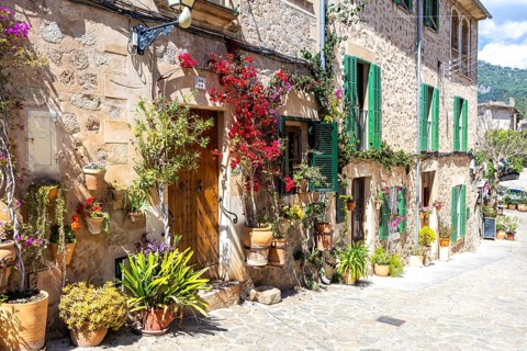 Valldemossa village on Majorca building with flowers trip in Valldemossa, Spain