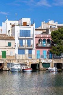 Colourful houses in Portocolom Fishing village on Majorca with boats Seaside holiday in Portocolom,