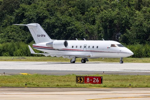 A Bombardier Challenger 604 private jet aircraft with the registration XA-OFM at San Juan Airport,