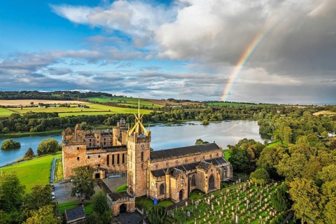Rainbow over Linlithgow Palace from a drone, Linlithgow Loch, West Lothian, Scotland, United