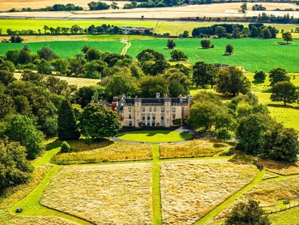 DefaultHouse of the Binns over Scotish farms and Forth Estuary from drone, Binns Tower, Linlithgow,
