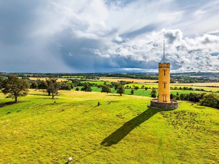 Binns Tower over Scotish farms and Forth Estuary from drone, House of the Binns, Linlithgow,