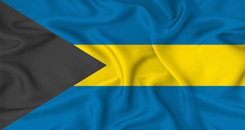 Realistic Bahamas flag waving. Close up of flag of Bahamas with cloth texture
