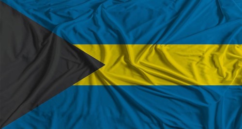 Bahamian flag with fabric texture background. National flag of Bahamas