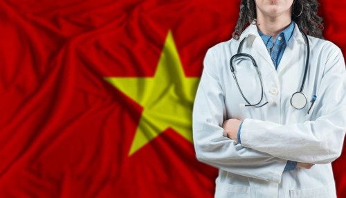 Medical professional on Vietnam flag. Healthcare and wellness in Vietnam, Concept