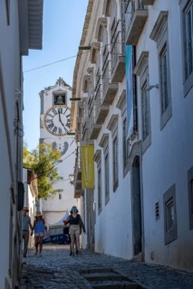 Old town alleys, catholic church Igreja de Santa Maria do Castelo in Tavira, in the Algarve,
