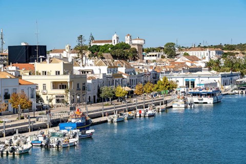 The old town centre of Tavira, on the Gilao River, boats, fishing boats, waterfront promenade, in